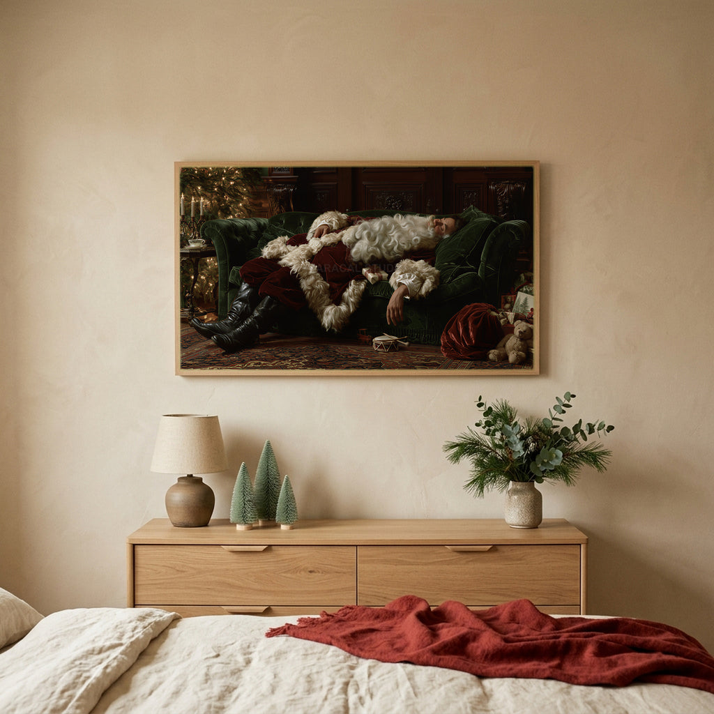 Sleeping Santa TV art above an oak dresser with small bottle-brush trees in a calm bedroom