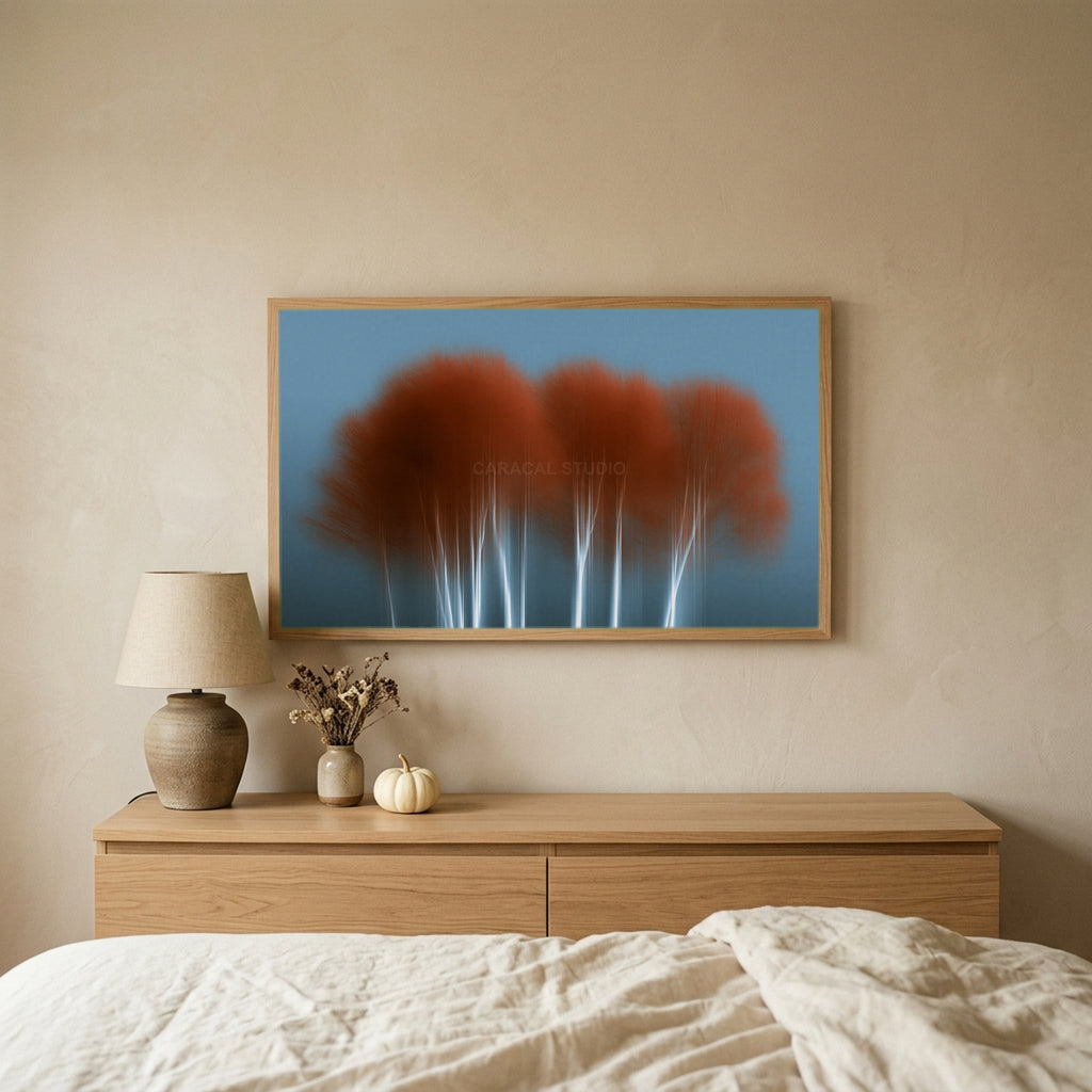 Abstract birch tree TV art above an oak dresser in a calm bedroom