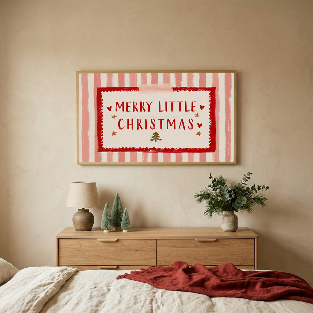 Merry Little Christmas TV art above an oak dresser with small bottle-brush trees in a calm bedroom