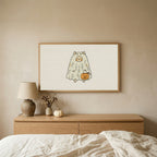 Ghost cat Halloween TV art above an oak dresser in a calm bedroom
