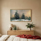Snowy New York park TV art above an oak dresser with small bottle-brush trees in a calm bedroom