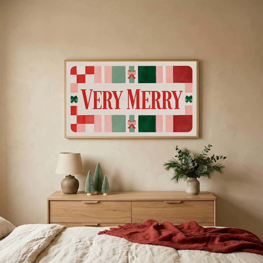 Very Merry typography TV art above an oak dresser with small bottle-brush trees in a calm bedroom