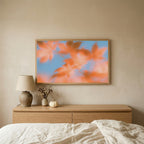 Autumn leaves TV art above an oak dresser in a calm bedroom