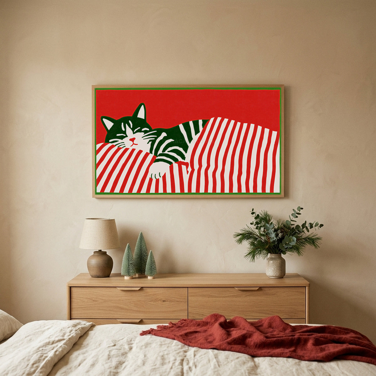 Sleeping cat and candy cane stripes TV art above an oak dresser with small bottle-brush trees in a calm bedroom