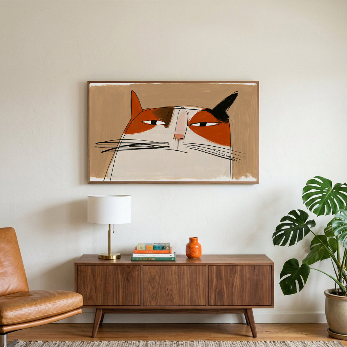 Calico cat face art on a TV above a walnut credenza with a brass lamp and a monstera plant