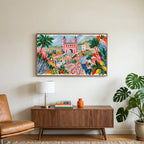 Mediterranean summer dance art on a TV above a walnut credenza with a brass lamp and a monstera plant