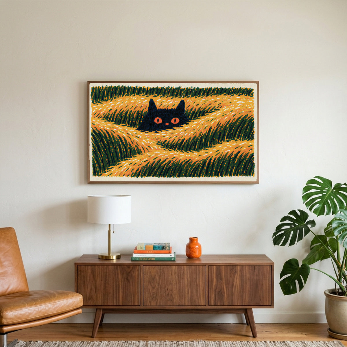 Black cat in grass art on a TV above a walnut credenza with a brass lamp and a monstera plant
