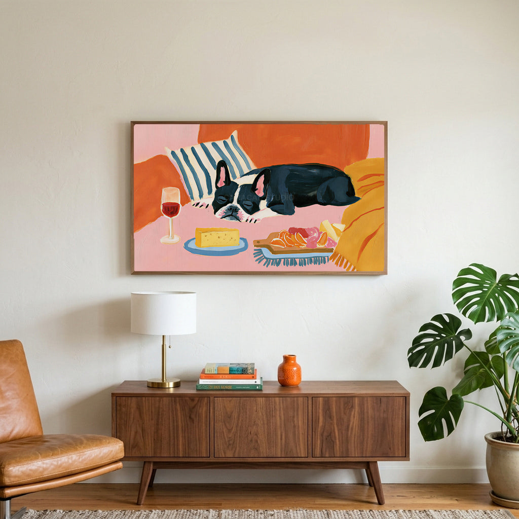 Sleeping French bulldog art on a TV above a walnut credenza with a brass lamp and a monstera plant