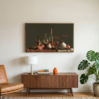 Wine and pomegranates still life art on a TV above a walnut credenza with a brass lamp and a monstera plant