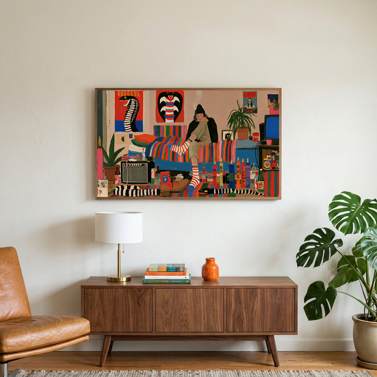 Eclectic retro room art on a TV above a walnut credenza with a brass lamp and a monstera plant