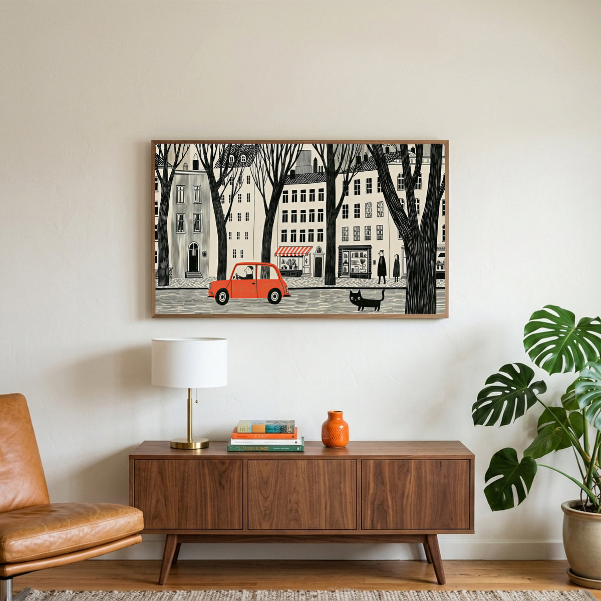 City street art on a TV above a walnut credenza with a brass lamp and a monstera plant