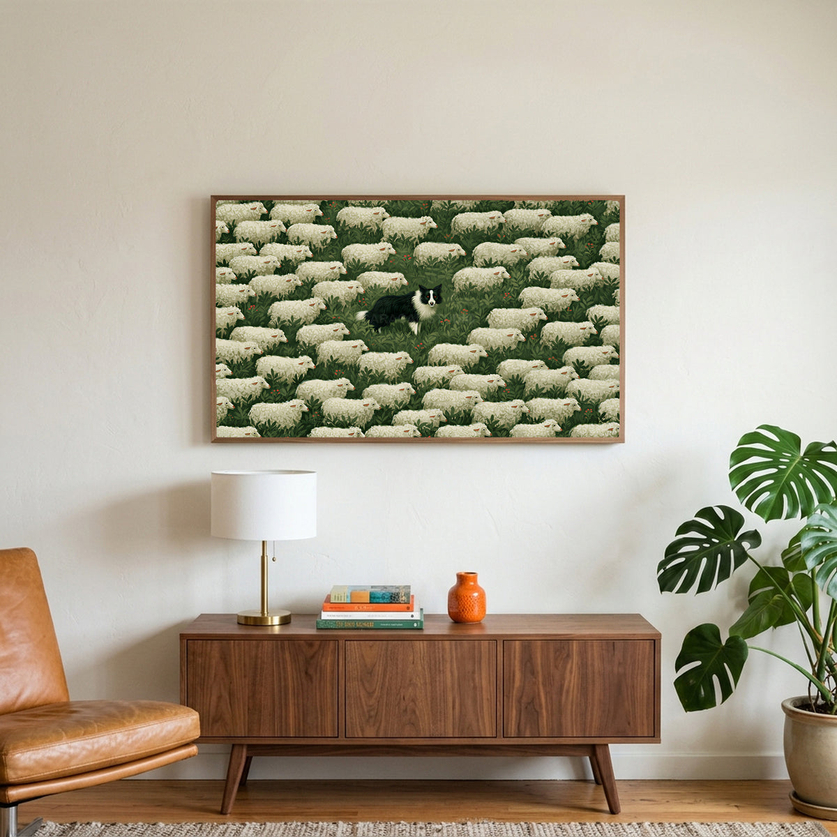 Border collie and sheep art on a TV above a walnut credenza with a brass lamp and a monstera plant