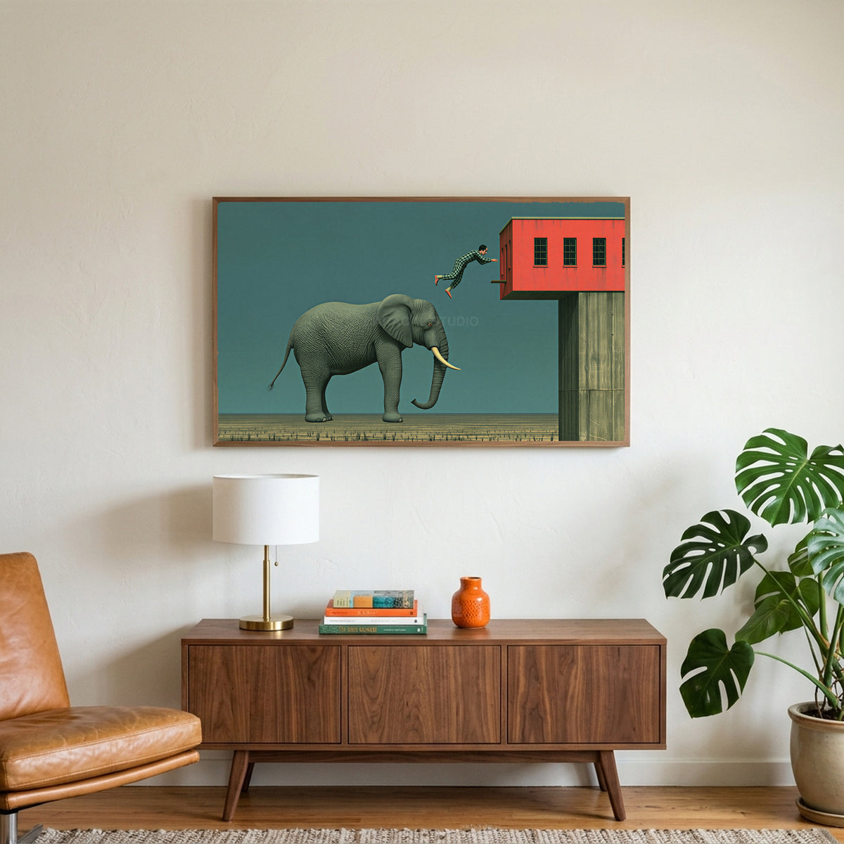 Elephant and leaping man art on a TV above a walnut credenza with a brass lamp and a monstera plant