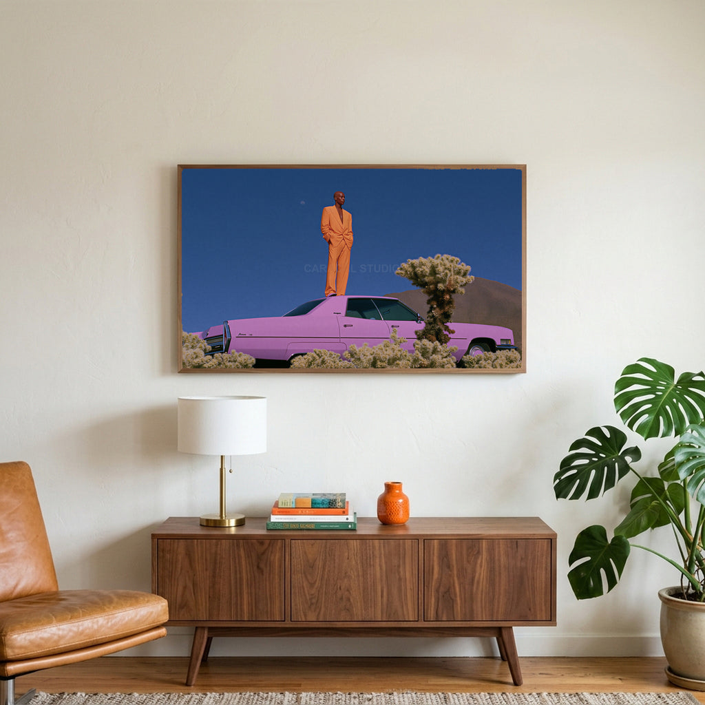 Pink car in the desert art on a TV above a walnut credenza with a brass lamp and a monstera plant