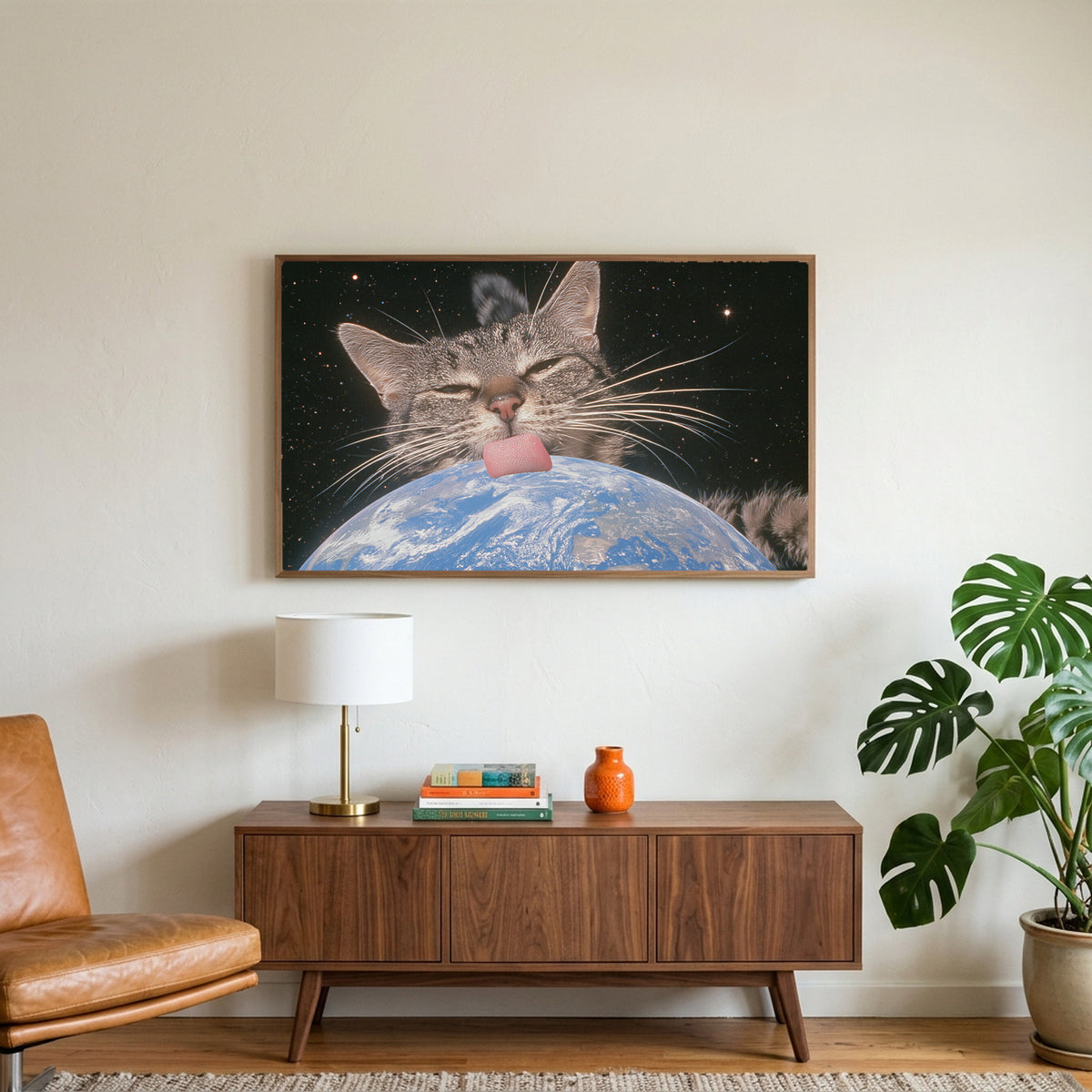 Space cat art on a TV above a walnut credenza with a brass lamp and a monstera plant