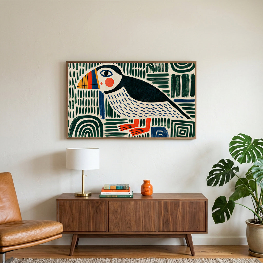 Folk art puffin art on a TV above a walnut credenza with a brass lamp and a monstera plant