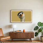Funny heron art on a TV above a walnut credenza with a brass lamp and a monstera plant