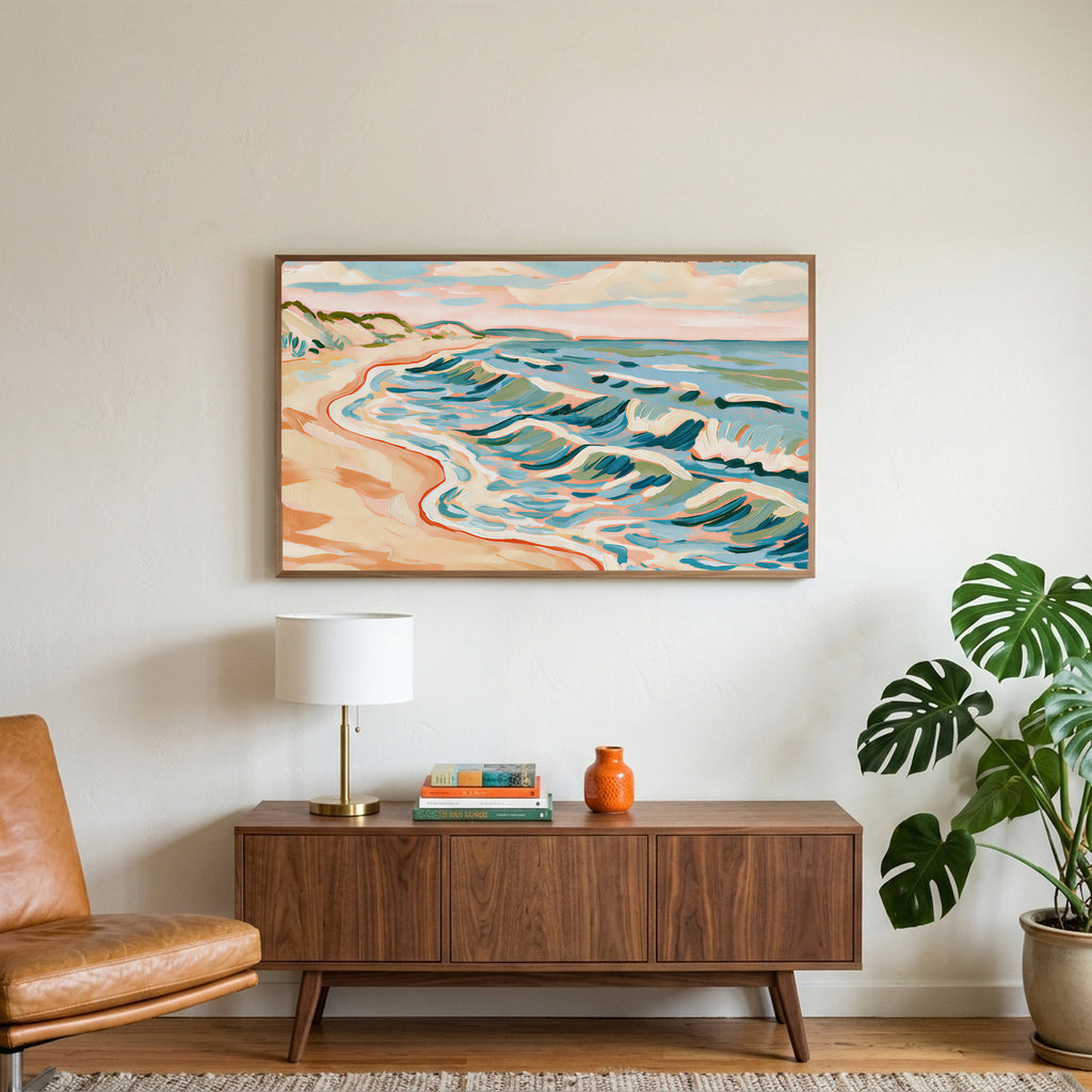 Beach waves art on a TV above a walnut credenza with a brass lamp and a monstera plant