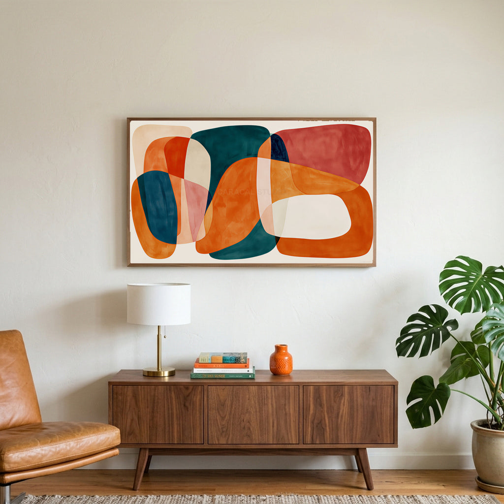 Organic shapes art on a TV above a walnut credenza with a brass lamp and a monstera plant
