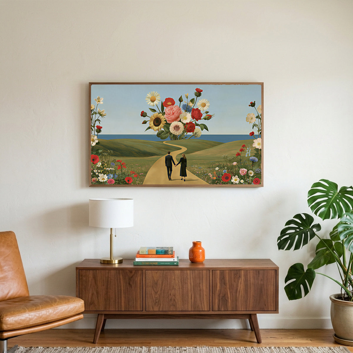 Flower collage art on a TV above a walnut credenza with a brass lamp and a monstera plant