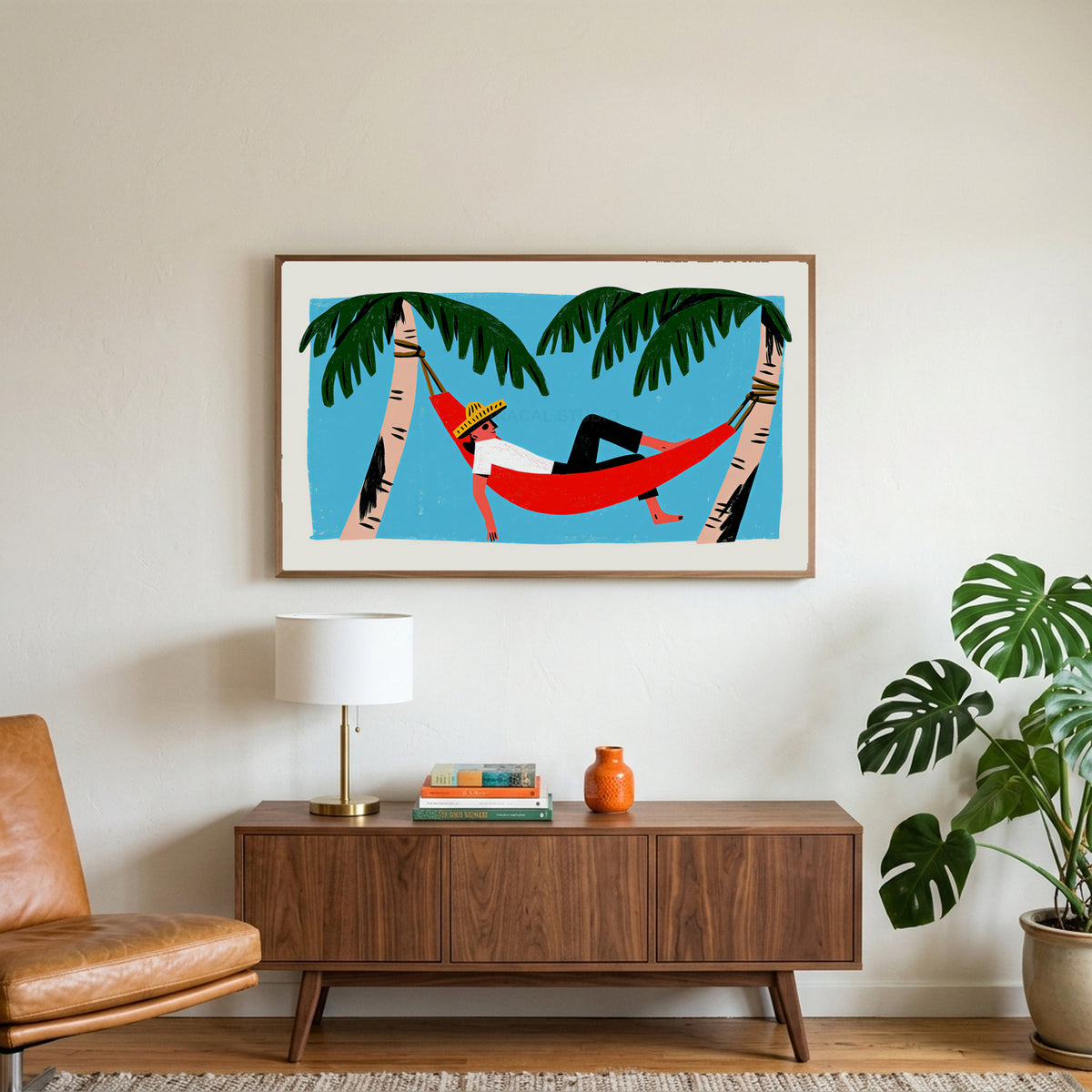 Hammock art on a TV above a walnut credenza with a brass lamp and a monstera plant