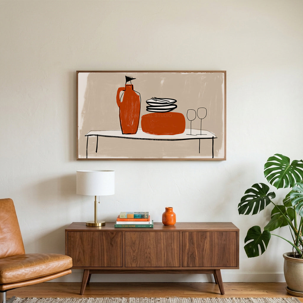 Minimalist table with jug and wine glasses art on a TV above a walnut credenza with a brass lamp and a monstera plant