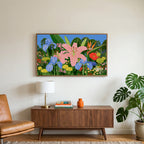 Tropical flower garden art on a TV above a walnut credenza with a brass lamp and a monstera plant