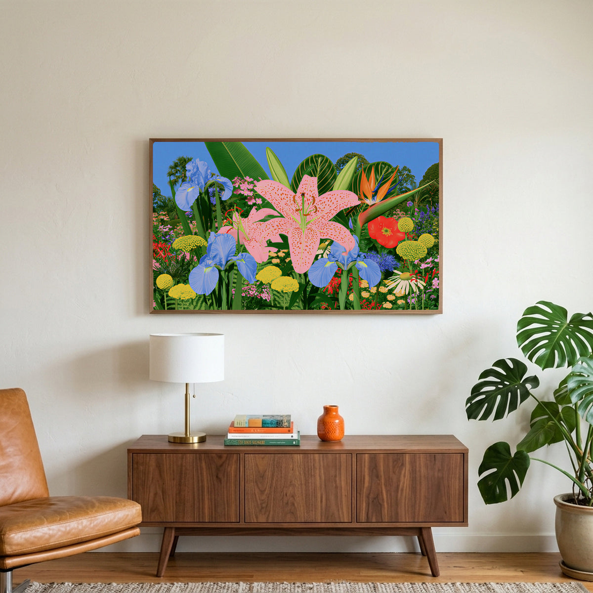 Tropical flower garden art on a TV above a walnut credenza with a brass lamp and a monstera plant