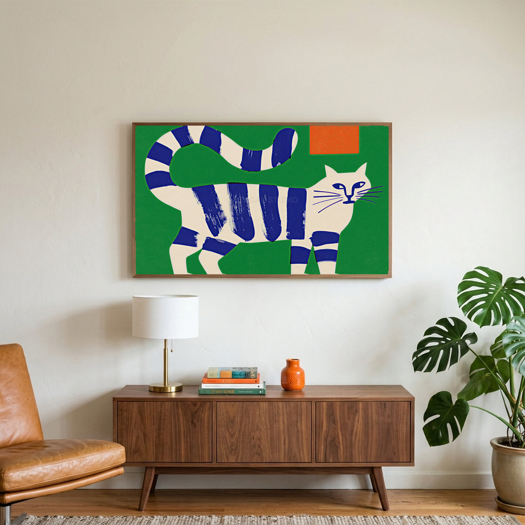 Blue striped cat art on a TV above a walnut credenza with a brass lamp and a monstera plant
