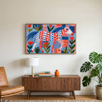 Folk art horse art on a TV above a walnut credenza with a brass lamp and a monstera plant