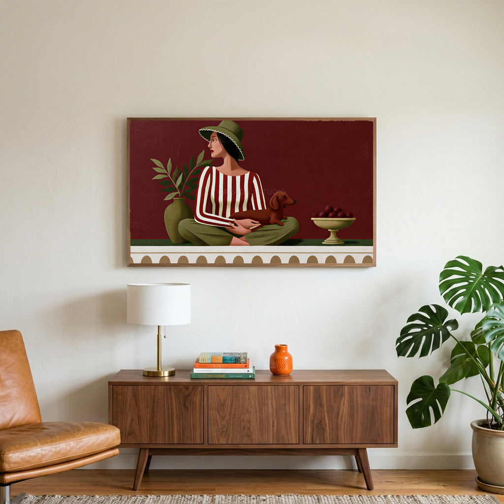 Woman with a dachshund art on a TV above a walnut credenza with a brass lamp and a monstera plant