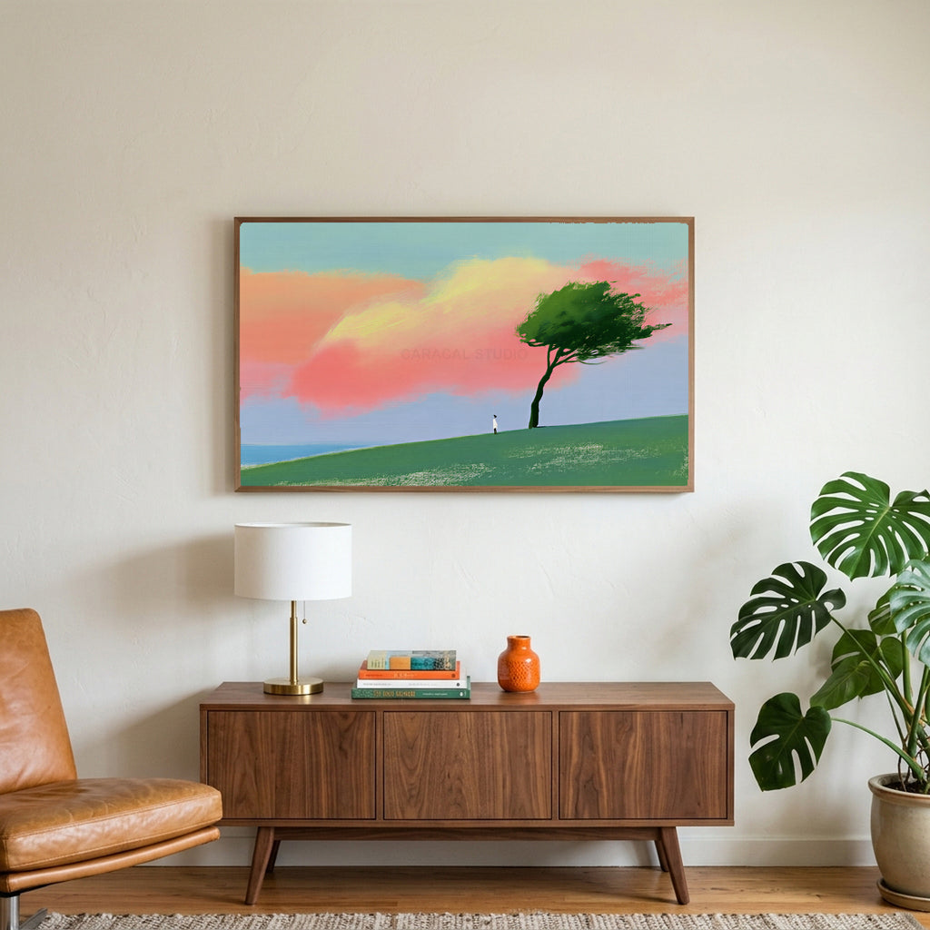 Tree on a hill at sunset art on a TV above a walnut credenza with a brass lamp and a monstera plant