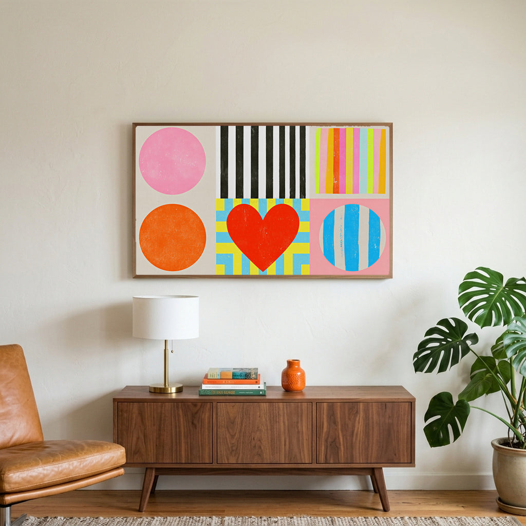 Colorful shapes and heart art on a TV above a walnut credenza with a brass lamp and a monstera plant