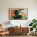 Green and peach abstract art on a TV above a walnut credenza with a brass lamp and a monstera plant