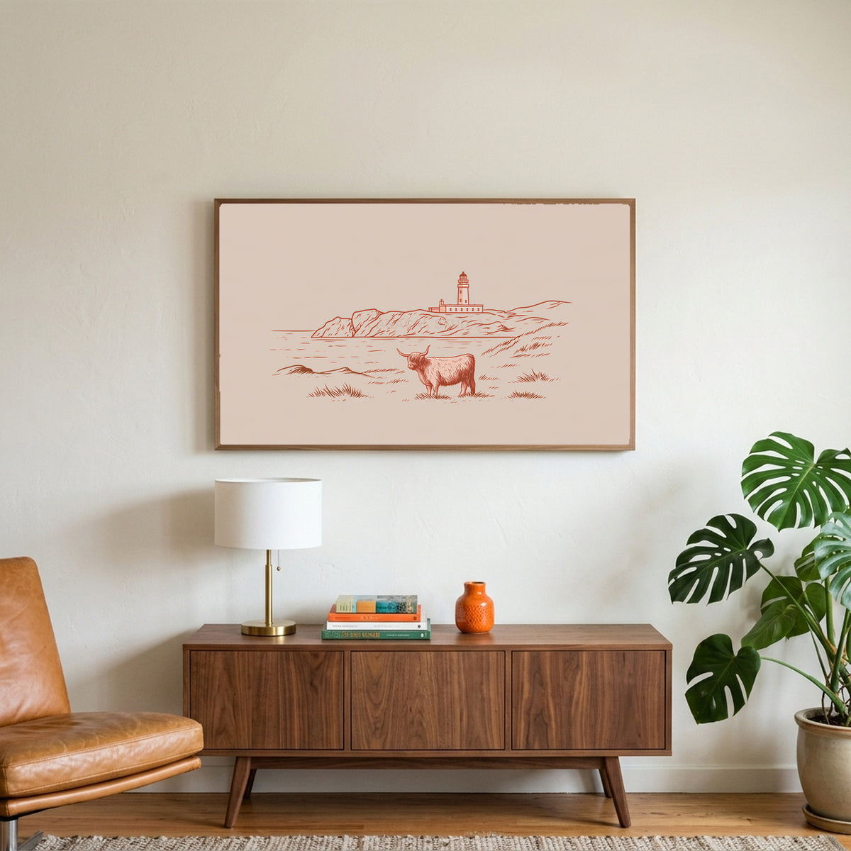 Highland cow lighthouse art on a TV above a walnut credenza with a brass lamp and a monstera plant