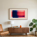 Color field art on a TV above a walnut credenza with a brass lamp and a monstera plant