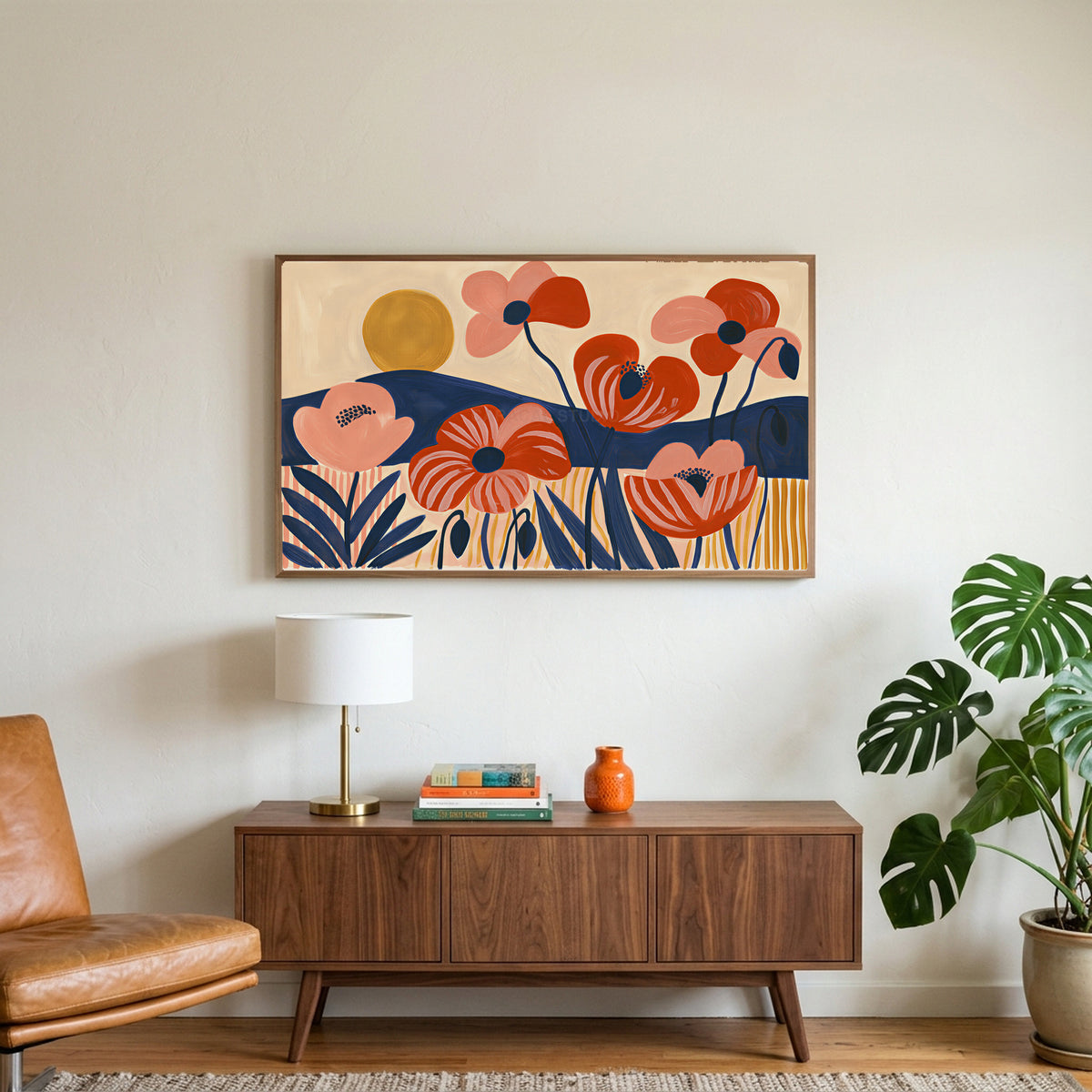 Mid century poppies art on a TV above a walnut credenza with a brass lamp and a monstera plant
