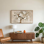 White hellebores art on a TV above a walnut credenza with a brass lamp and a monstera plant