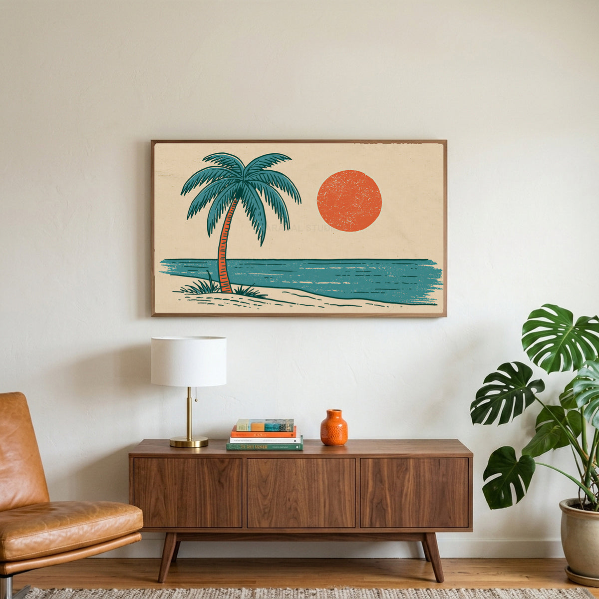 Retro palm tree art on a TV above a walnut credenza with a brass lamp and a monstera plant