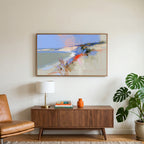 Abstract chalk cliffs art on a TV above a walnut credenza with a brass lamp and a monstera plant