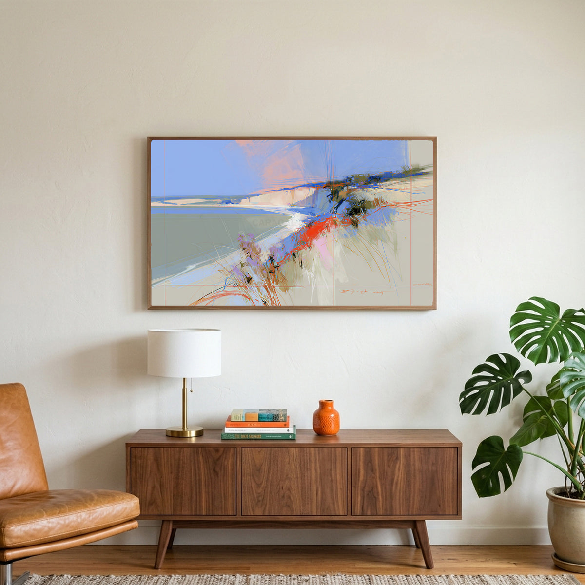 Abstract chalk cliffs art on a TV above a walnut credenza with a brass lamp and a monstera plant