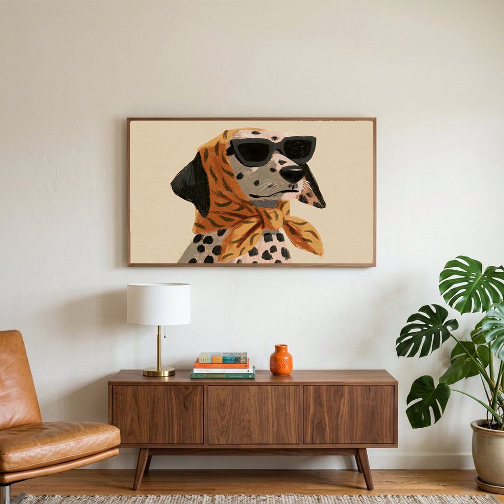Dalmatian in sunglasses art on a TV above a walnut credenza with a brass lamp and a monstera plant