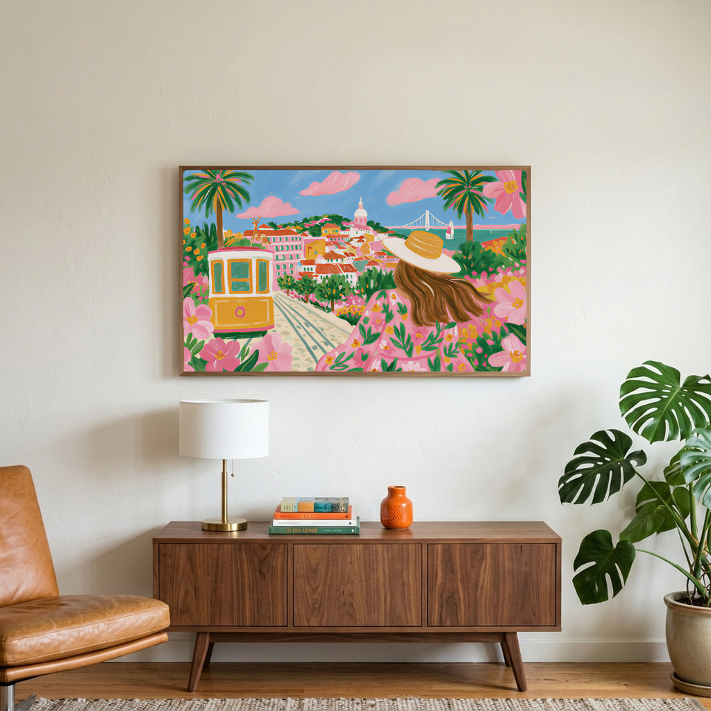 Lisbon tram art on a TV above a walnut credenza with a brass lamp and a monstera plant
