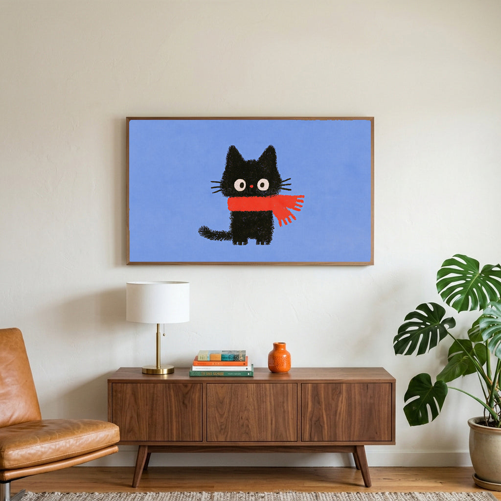 Black kitten in a scarf art on a TV above a walnut credenza with a brass lamp and a monstera plant