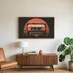 Retro cassette tape art on a TV above a walnut credenza with a brass lamp and a monstera plant