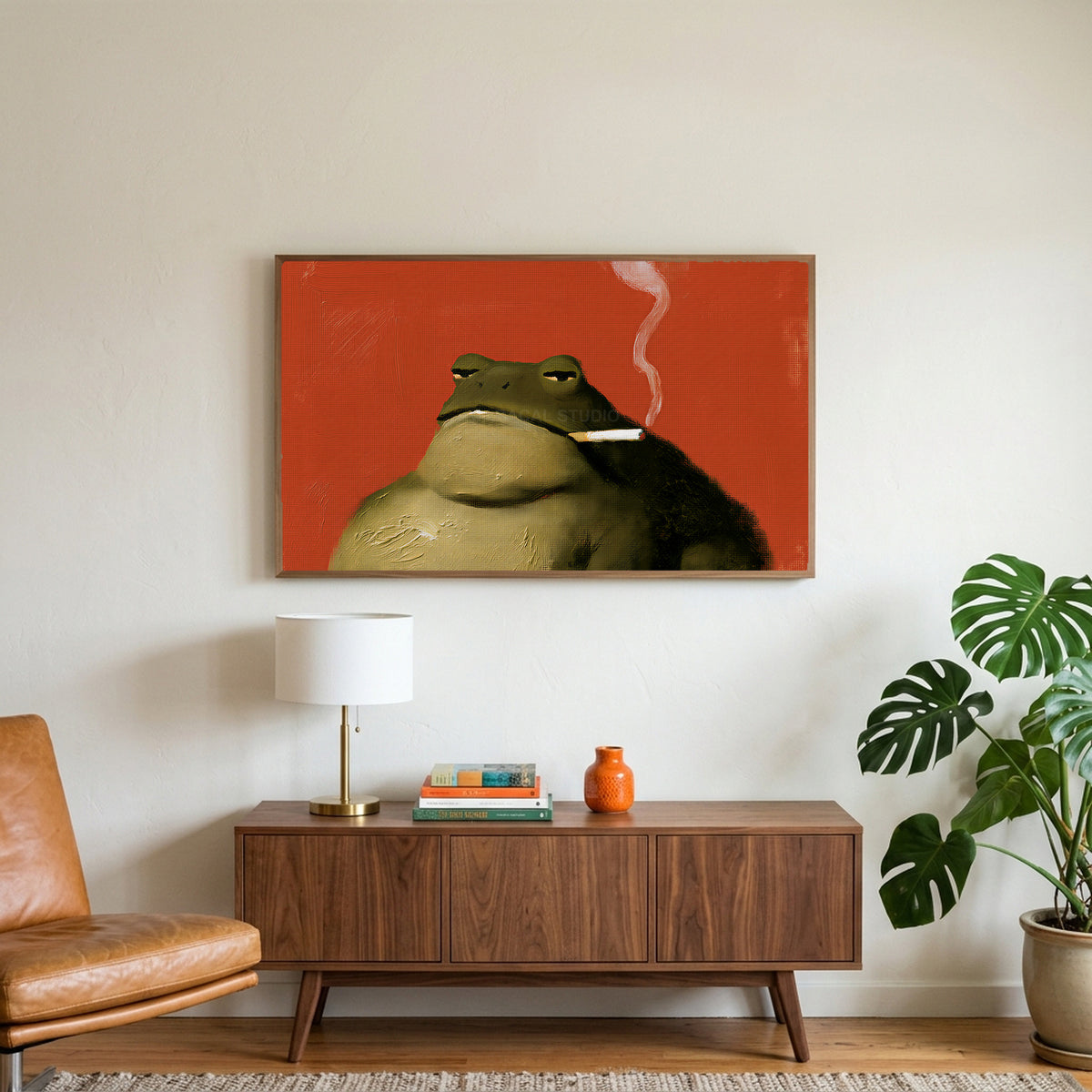 Smoking toad art on a TV above a walnut credenza with a brass lamp and a monstera plant