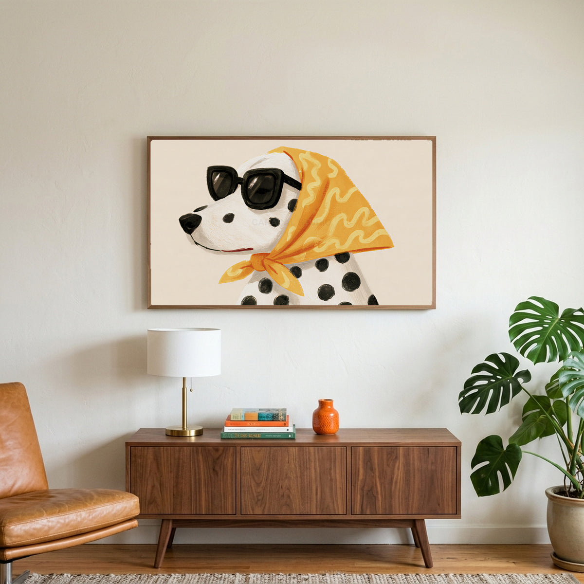 Dalmatian art on a TV above a walnut credenza with a brass lamp and a monstera plant