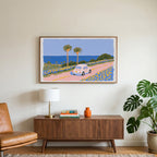 Seaside car art on a TV above a walnut credenza with a brass lamp and a monstera plant