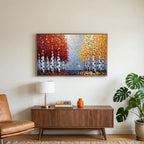 Autumn birch trees art on a TV above a walnut credenza with a brass lamp and a monstera plant