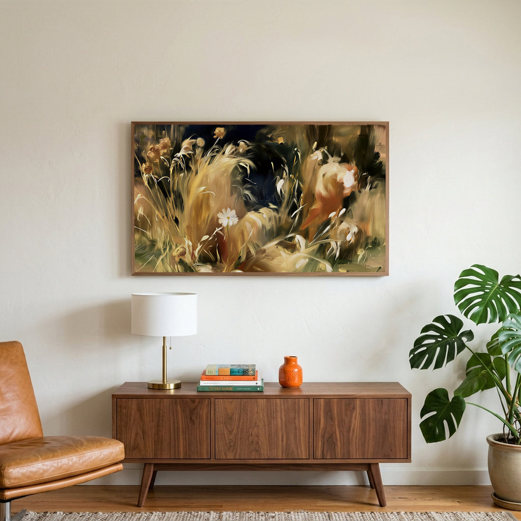 Wild grass and white flower art on a TV above a walnut credenza with a brass lamp and a monstera plant